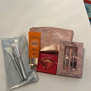 Ipsy bag with lip gloss and eyeshadow with 2 in 1 radiance polishing mask.